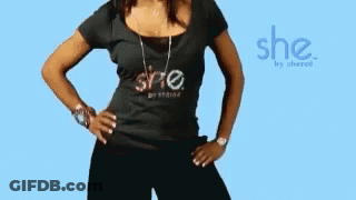 A Woman Is Wearing A Black Shirt That Says She GIF