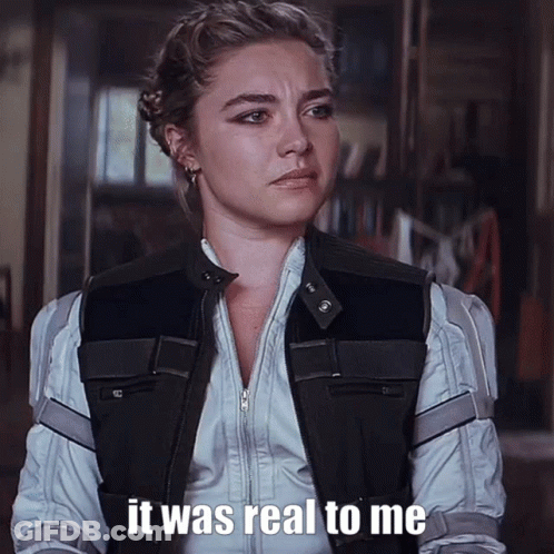 A Woman Is Wearing A Black Vest And A White Shirt And Says It Was Real To Me GIF