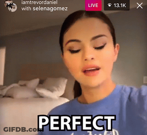 A Woman Is Wearing A Blue Shirt That Says Perfect On It GIF