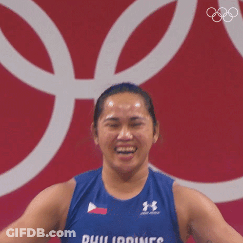 A Woman Is Wearing A Blue Tank Top That Says Philippines On It GIF