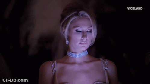 A Woman Is Wearing A Choker And Earrings And The Word Viceland Is On The Bottom GIF