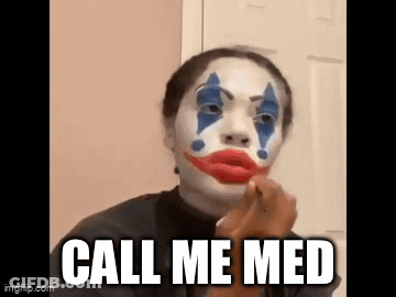 A Woman Is Wearing A Clown Costume And Applying Makeup . GIF