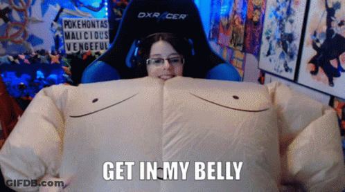 A Woman Is Wearing A Costume That Says " Get In My Belly " On The Bottom GIF