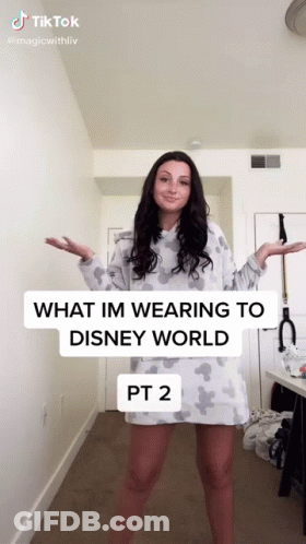 A Woman Is Wearing A Disney World Dress And A Tiktok Video GIF
