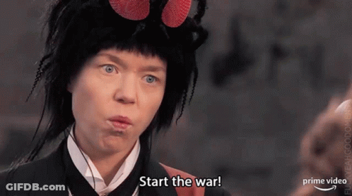 A Woman Is Wearing A Fly Costume And Making A Funny Face . GIF