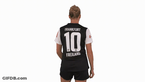 A Woman Is Wearing A Jersey With The Number 10 On The Back GIF