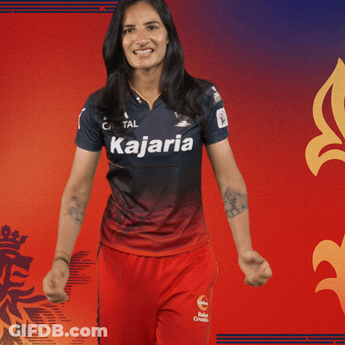 A Woman Is Wearing A Kajaria Jersey GIF
