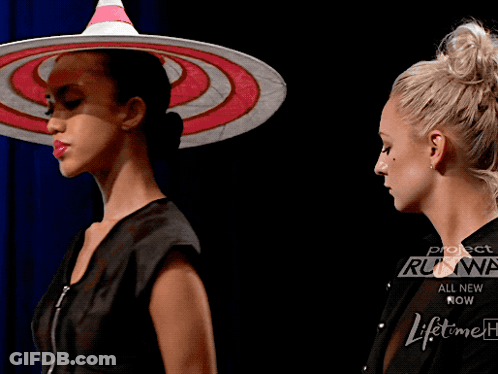 A Woman Is Wearing A Pair Of Underwear That Says Project Runway On It GIF