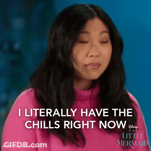 A Woman Is Wearing A Pink Sweater And Says I Literally Have The Chills Right Now . GIF