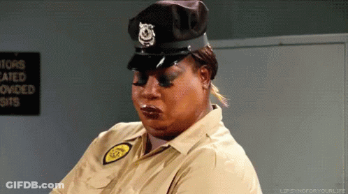A Woman Is Wearing A Police Uniform And A Hat GIF