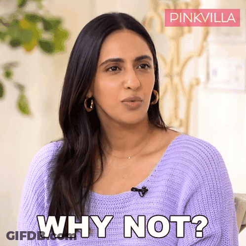 A Woman Is Wearing A Purple Sweater And Says Why Not GIF