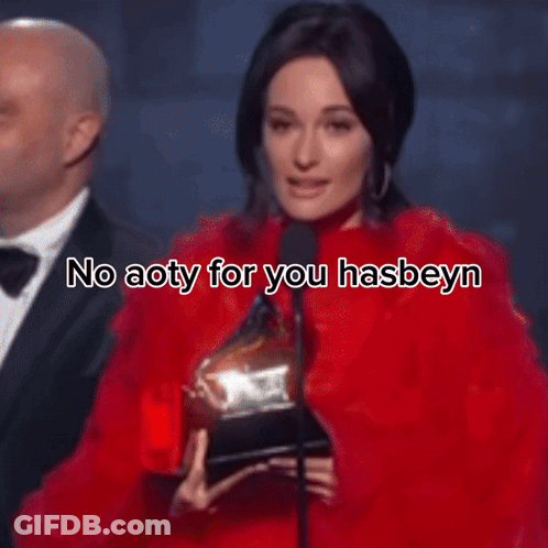 A Woman Is Wearing A Red Dress And A Necklace And Says Help Me Kacey GIF