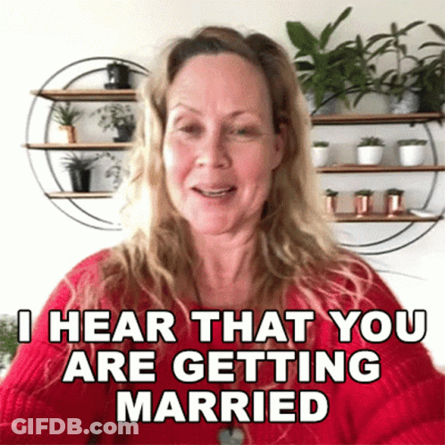 A Woman Is Wearing A Red Sweater And Says I Hear That You Are Getting Married GIF