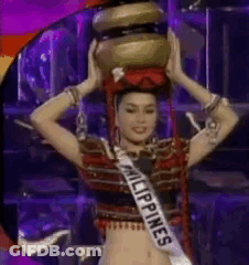A Woman Is Wearing A Sash That Says Philippines And Is Holding A Bowl On Her Head . GIF
