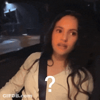 A Woman Is Wearing A Seat Belt And Has A Question Mark On Her Chest GIF
