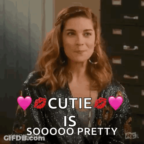 Woman In Sequined Jacket With Hearts And Cutie Text GIF