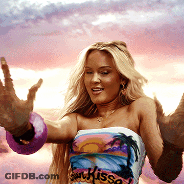 A Woman Is Wearing A Shirt That Says Sin Kisso On It GIF
