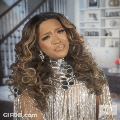 Woman In Silver Fringe Dress With Rhinestone Necklace GIF