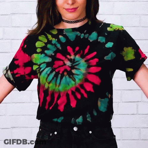 A Woman Is Wearing A Tie Dye Shirt GIF