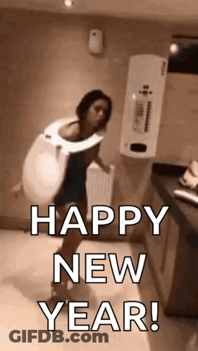 A Woman Is Wearing A Toilet Seat And Dancing In A Bathroom . GIF