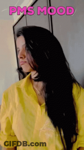 A Woman Is Wearing A Yellow Shirt With The Words Pms Mood Written On It GIF
