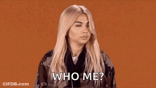 A Woman Is Wearing Headphones And A Camouflage Jacket And Asking Who Me . GIF