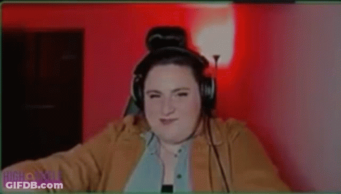 A Woman Is Wearing Headphones And Says She 'S Out For Blood . GIF