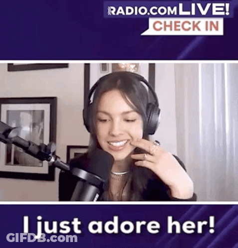 Woman Smiling With Headphones In Front Of Microphone GIF