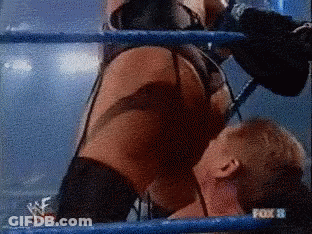 A Woman Is Wrestling A Man In A Ring With A Fox 8 Logo In The Background GIF