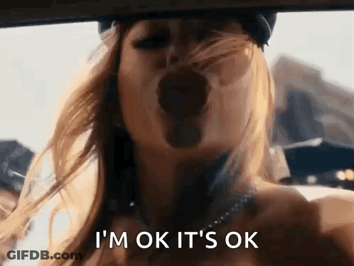A Woman Is Yawning In A Car And Saying I 'M Ok It 'S Ok GIF