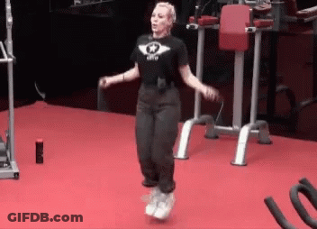 A Woman Jumping A Jump Rope In A Gym GIF
