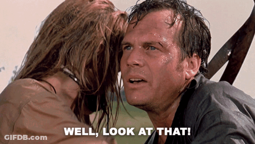A Woman Kissing A Man 'S Forehead With The Words Well Look At That GIF