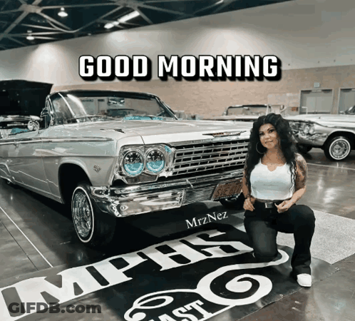 A Woman Kneeling In Front Of A Car With The Words Good Morning Written Above Her GIF