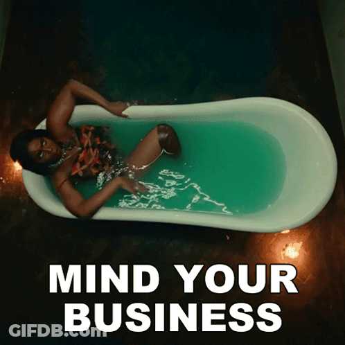 A Woman Laying In A Bathtub With The Words Mind Your Business Above Her GIF