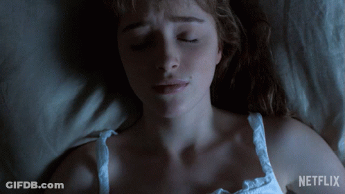 A Woman Laying In Bed With Her Eyes Closed And A Netflix Logo On The Bottom GIF