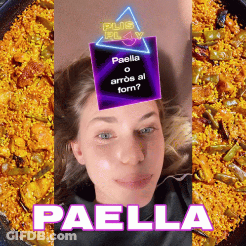 A Woman Laying In Front Of A Plate Of Paella GIF