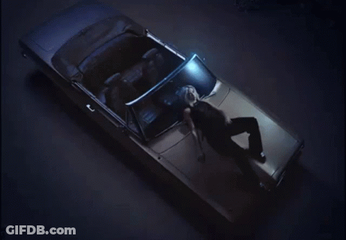 A Woman Laying In The Back Of A Car GIF
