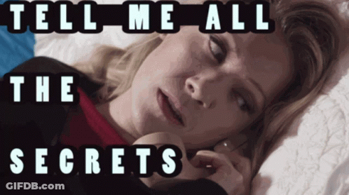 A Woman Laying On A Bed With The Words Tell Me All The Secrets Written Above Her GIF