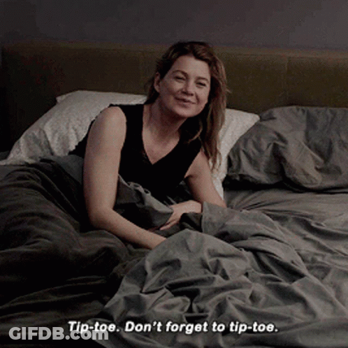 A Woman Laying On A Bed With The Words Tip-Toe Don 'T Forget To Tip-Toe Below Her GIF