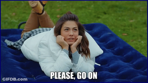 A Woman Laying On A Blue Mattress With The Words Please Go On Written Below Her GIF