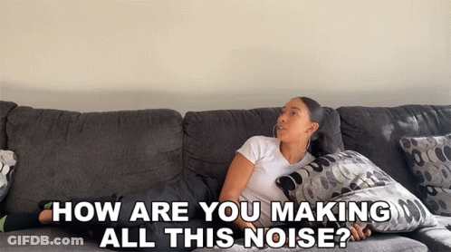 A Woman Laying On A Couch With The Words " How Are You Making All This Noise " GIF