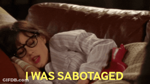 A Woman Laying On A Couch With The Words " I Was Sabotaged " On The Bottom GIF
