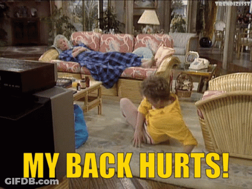 A Woman Laying On A Couch With The Words " My Back Hurts " Below Her GIF