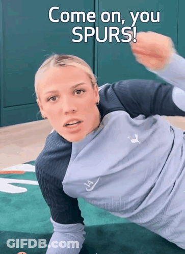 A Woman Laying On A Mat With The Words Come On You Spurs GIF