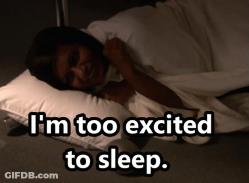 A Woman Laying On A Pillow With The Words " I 'M Too Excited To Sleep " Above Her GIF