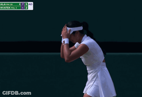 A Woman Laying On A Tennis Court With A Towel Around Her Head GIF