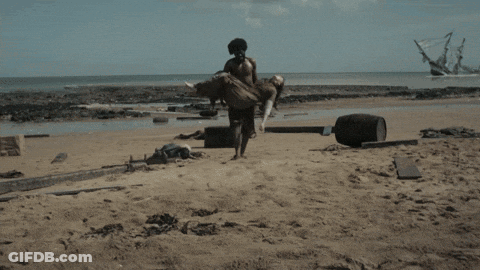 A Woman Laying On The Beach With The Words Our Heroine Was A Stowaway Carried To Shore By Another Survivor Visible GIF