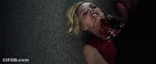 A Woman Laying On The Floor With Blood On Her Neck GIF