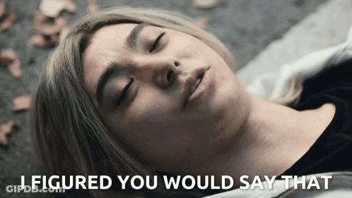 A Woman Laying On The Ground With The Words " I Figured You Would Say That " Below Her GIF