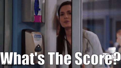 A Woman Leaning Against A Wall With The Words What 'S The Score Written On The Bottom GIF